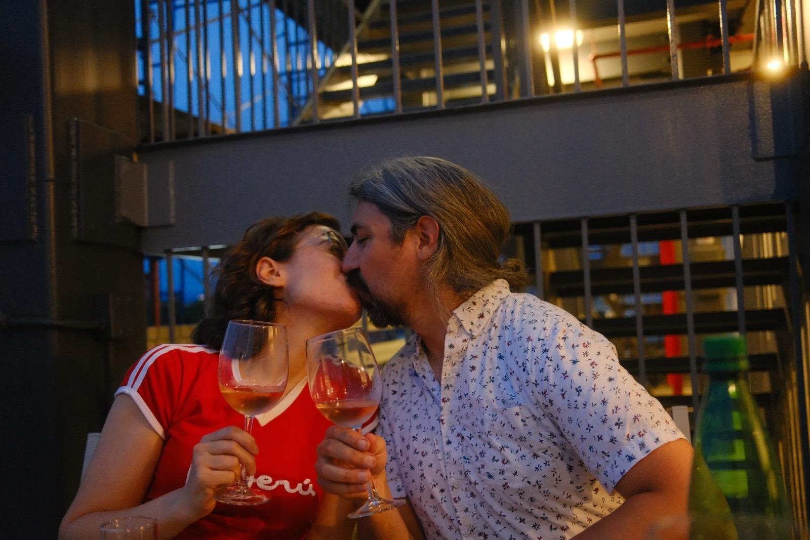 Julia and Daniel toasting with wine